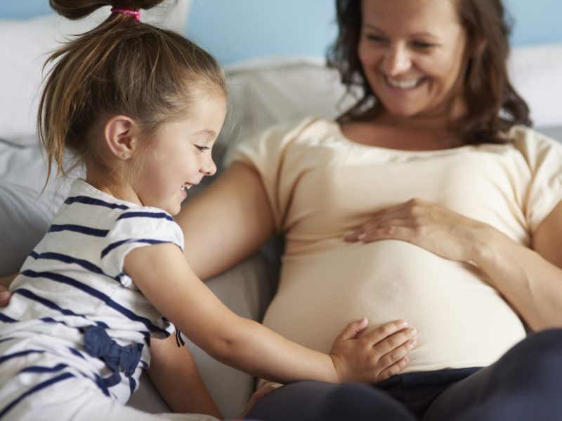 Little girl waiting for her future sibling